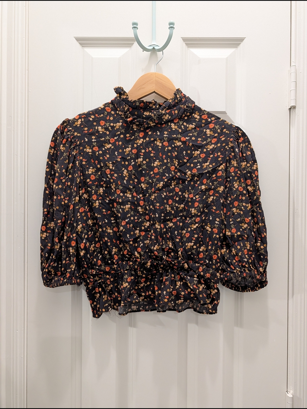 Olivaceous Black Floral Ruffle Neck Smocked Blouse